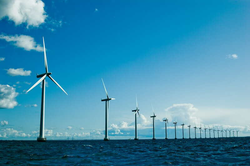A line of wind turbines in an array